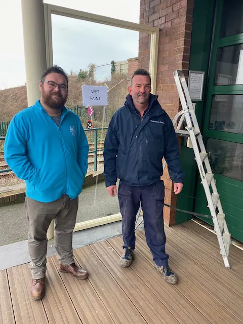 Chris from Middleton Glass Ltd., fitting new windows at The Talyllyn Railway in Tywyn